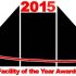 GBMpic_ Grafisches Logo für die Auszeichnung „Einrichtung des Jahres 2015“ mit fettgedrucktem Text und abstrakten Gebäudeformen.